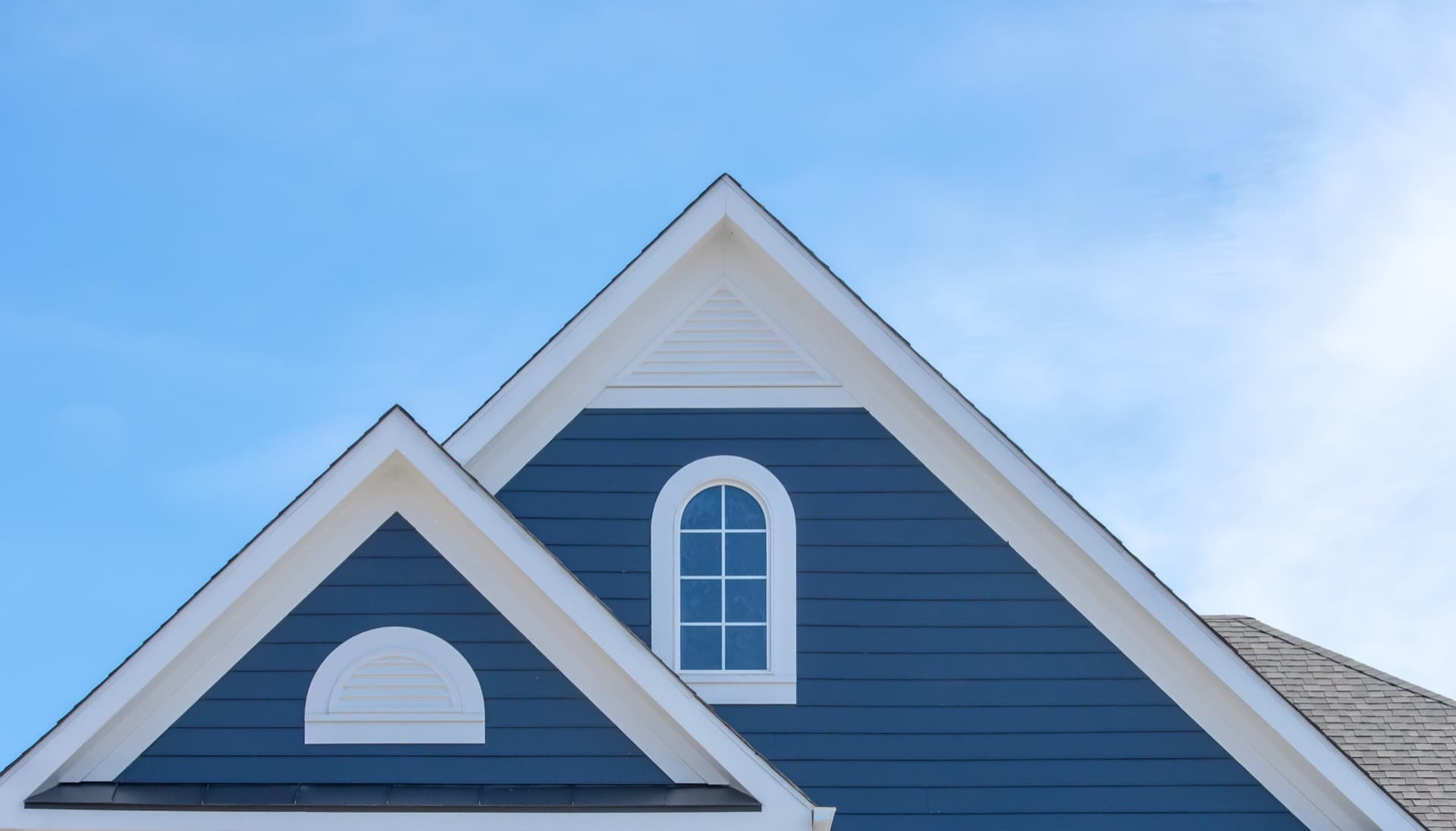 Gabled roofline and siding of a home, the kind of exterior Juan inspects in Petaluma