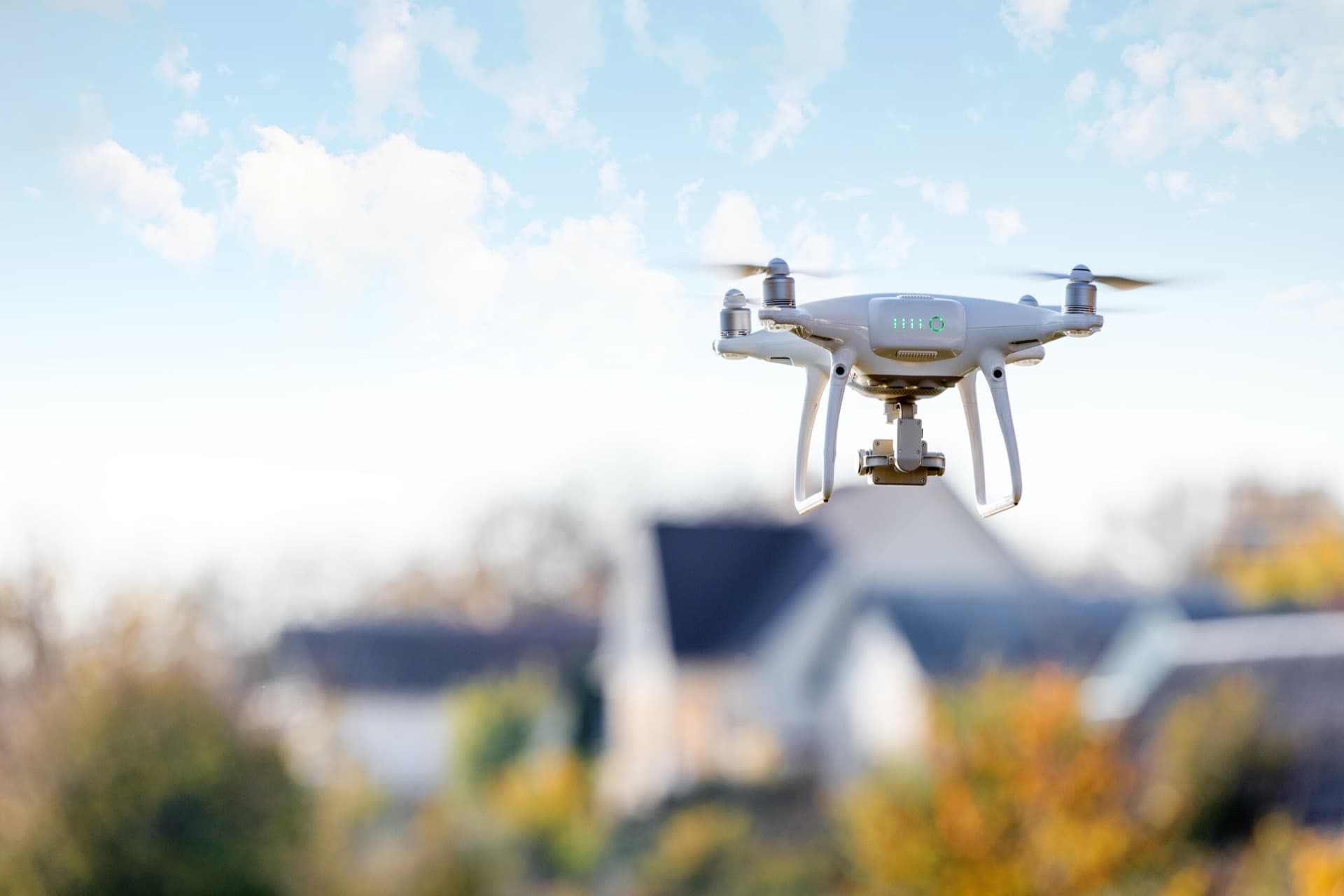 Inspection drone flying above homes