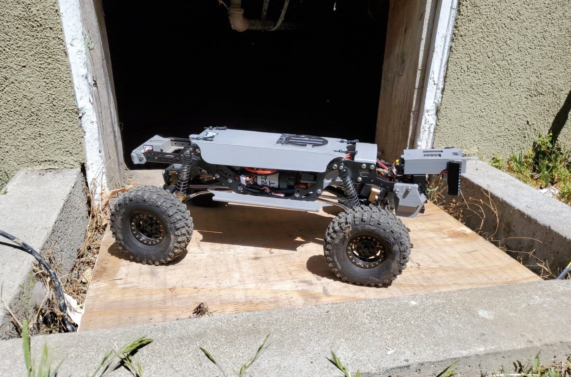 The “Big Crawler” crawlspace drone at the entrance of a crawlspace