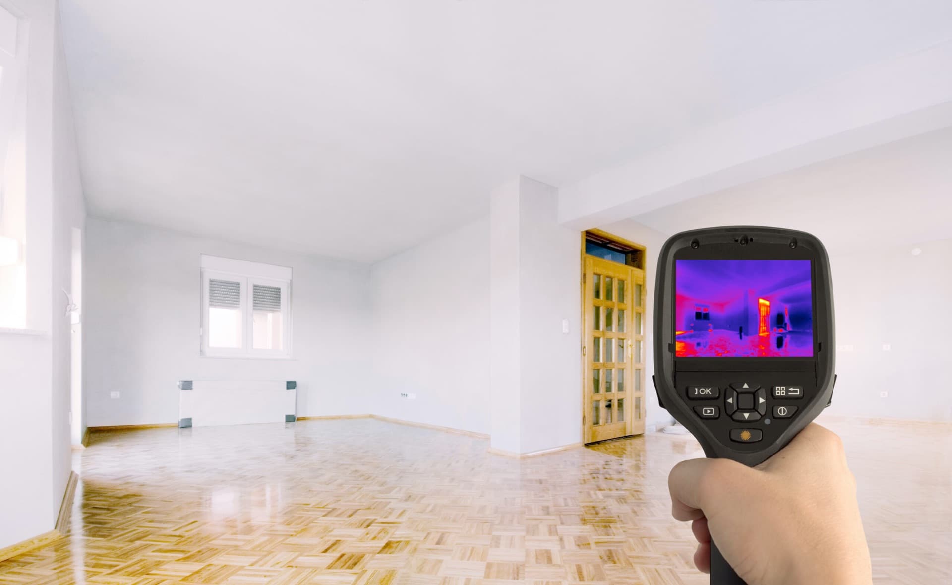 Thermal imaging camera scanning a room for hidden defects